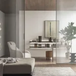 Living room with a glass partition and matched timber finishes