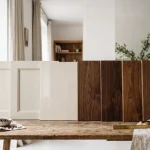 Cream lacquered cabinet doors next to walnut samples
