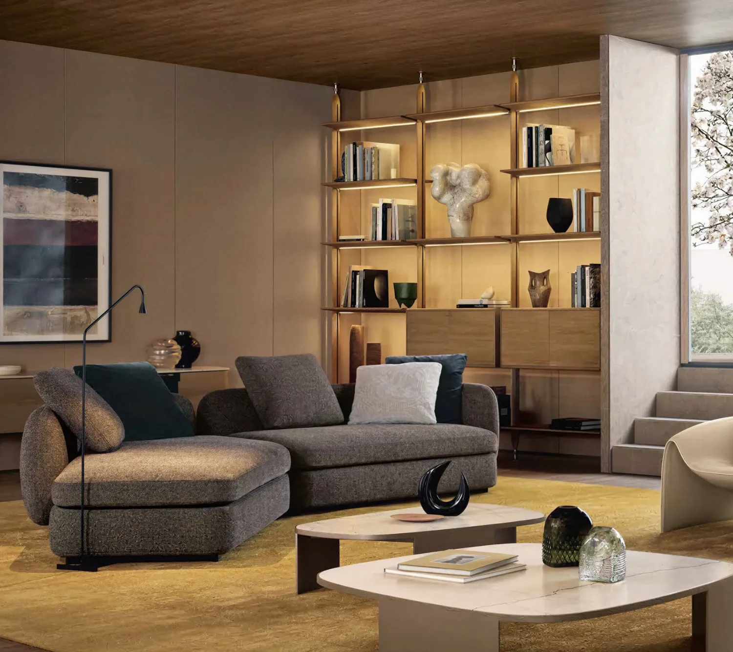 Living room with walnut wall panels, built-in shelving and a flush door by DWC Millwork
